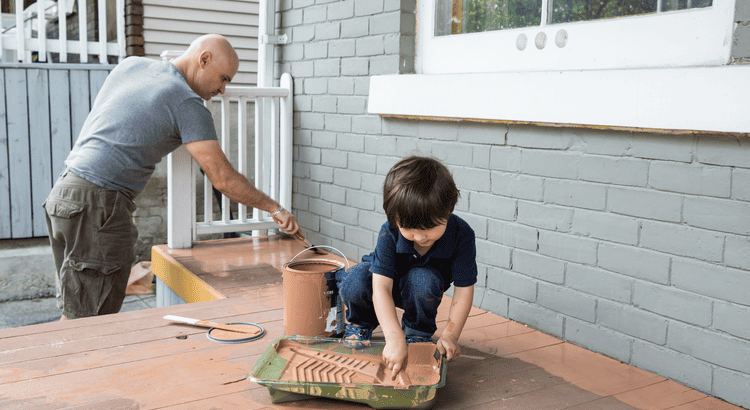 Photo of a man and his son working on a deck